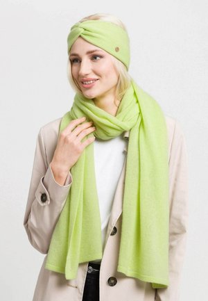 Light green scarf and headband set made from soft material. Scarf is long and rectangular; headband features a twisted design with a button accent.