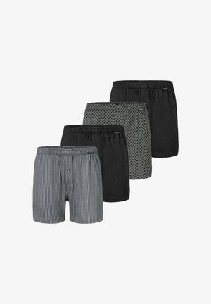 Neljä paria bokserit: yksi harmaa raidallinen, kaksi täysin mustaa ja yksi geometrisella kuviolla, kaikki elastisilla vyötäröillä ja pehmeästä kankaasta valmistettuja.