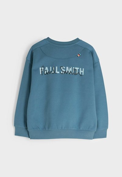 Sinine dressipluus ümmarguse kaelusega, ribiga mansettide ja äärtega, millel on "Paul Smith" kihilised tähed ja värviline aktsent õlal.