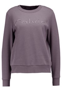 Sudadera morada con cuello redondo, mangas largas, puños y dobladillo acanalados, con un logo en relieve de "Calvin" en la parte frontal.