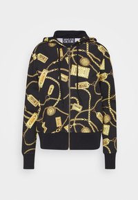 Hoodie noir avec un motif de chaîne dorée et d'étiquette. Fabriqué en tissu doux, avec une fermeture éclair à l'avant, une capuche à cordon de serrage réglable et des poignets côtelés.