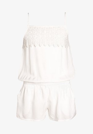 Hvid ærmeløs romper med blonde detaljer på brystet, elastisk talje og shorts med sidelommer.