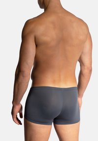 Dark gray fitted boxer shorts with a smooth texture, featuring a simple waistband and minimal design, viewed from the back.