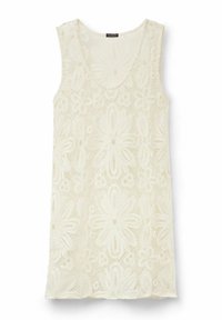 Top sin mangas de encaje en blanco roto, con patrones florales, escote de barco y diseño sin mangas. Textura ligera con dobladillo en forma de ondas.