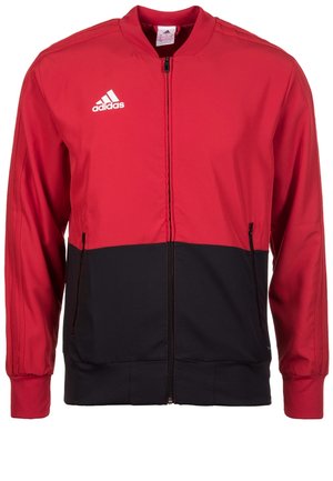 Adidas-Jacke mit rotem oberen Bereich und schwarzem unteren Abschnitt, Reißverschluss vorne, gerippten Bündchen und weißem Logo auf der linken Brust. Glatte Stofftextur.