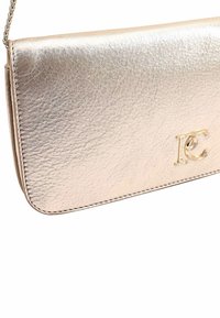 Metallic gold leather clutch with a smooth texture, snap closure, and a logo accent. Features a stitched edge and a chain strap.