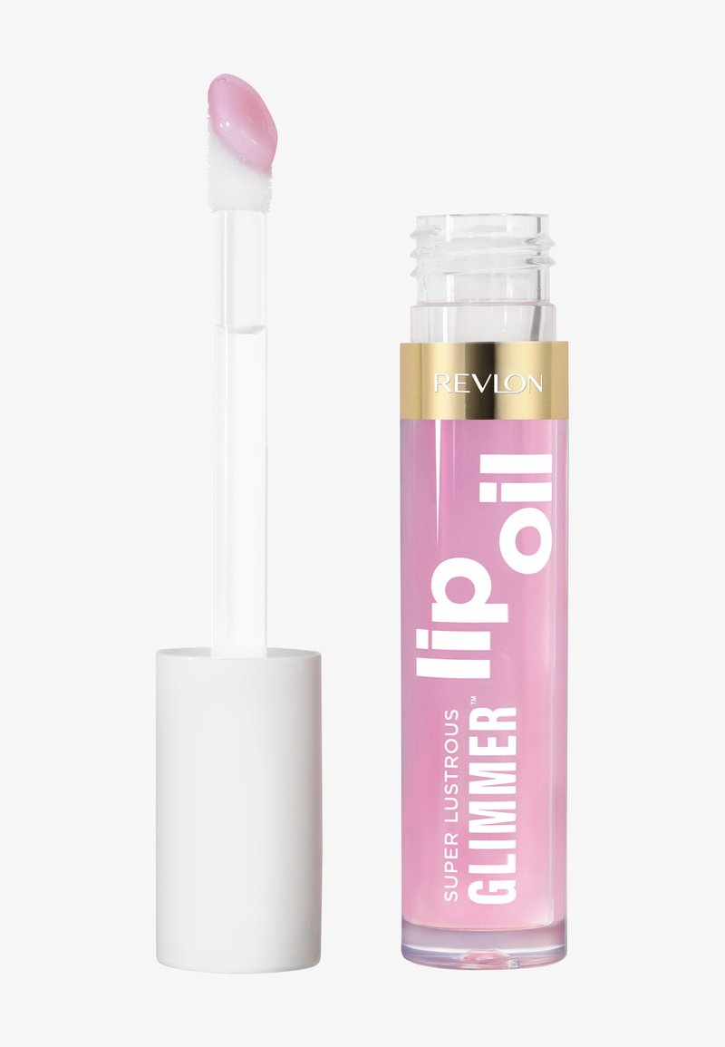 Przezroczysta szklana tubka różowego olejku do ust z białymi i złotymi akcentami. Zawiera przezroczystą aplikator z zaokrąglonym końcem.