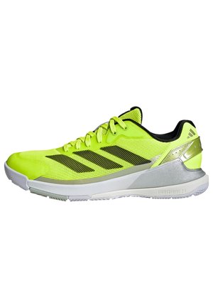Bright yellow athletic shoe featuring mesh upper, black accents, three diagonal stripes, and a silver heel detail with a white midsole.