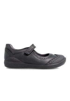 Zapato negro tipo Mary Jane hecho de cuero con detalles perforados, correa ajustable, punta redonda y suela de goma texturada.