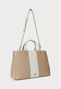 Beige and white structured handbag with dual handles and a detachable strap, featuring a vertical white stripe and logo detail.