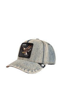 Denim cap featuring a black rectangular patch with an embroidered eagle design and the word "SAVAGE." Light blue, slightly faded fabric.