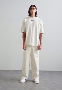 A-COLD-WALL* FORMAT PANT - Housut - beige bone