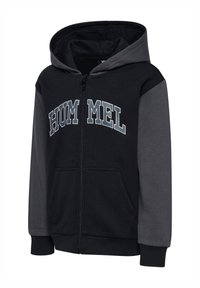 Svart och grå zip-up hoodie med en stor "HUMMEL"-logotyp, framfickor och en dragsko i huvan, tillverkad av mjukt bomullsblandat tyg.