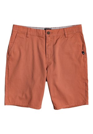 Shorts couleur rouille en mélange de coton, dotés d'une fermeture à bouton, de deux poches latérales et d'un petit écusson logo sur la poche avant.