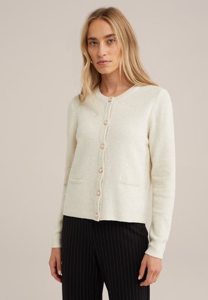 Cream-colored knit cardigan with a textured pattern, round neckline, front button closure, two pockets, and long sleeves.