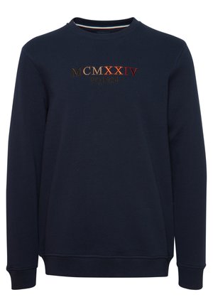 Námořnická modrá mikina vyrobená z bavlny, s vyšívaným designem "MCMXXIV FQ1924" ve zlaté, oranžové a červené barvě na přední straně.