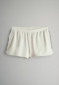 Beli kratki hlači z gladko teksturo, elastičnim pasom, stranskimi žepi in črnimi stranskimi poudarki. Namenjene so za priložnostno nošenje.