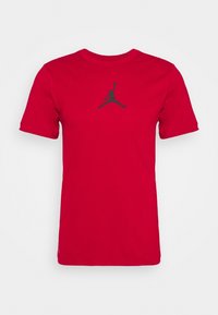 Rode korte mouwen T-shirt van katoen, met een zwart Jordan-logo gecentreerd op de borst. Zachte textuur, rond de hals ontwerp.