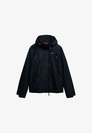 Giacca impermeabile blu navy con cappuccio, chiusura frontale con zip e numerose tasche con zip. Presenta cordini regolabili e tessuto testurizzato.
