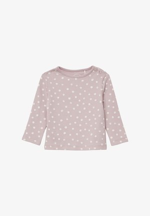 Chemise rose pâle à manches longues avec des pois blancs, texture côtelée et boutons pression sur l'épaule. Design simple et décontracté.