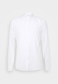 Camicia bianca a maniche lunghe in lino leggero, con colletto a punta, orlo dritto e una leggera texture.