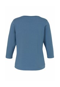 Blaues Langarmshirt mit rundem Ausschnitt und entspannter Passform. Glatter Stoff mit einfarbigem Finish, keine sichtbaren Muster oder Verzierungen.