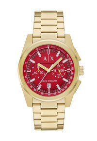 Orologio da polso in acciaio inossidabile dorato con quadrante rosso, marcature bianche e due sotto-quadranti. Presenta una finestra per la data e un design di braccialetto a maglie elegante.