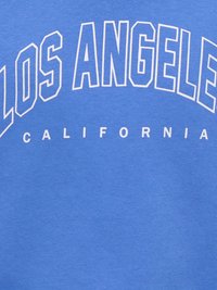 Tissu bleu avec le texte blanc contouré "LOS ANGELES" courbé au-dessus d'un texte blanc plus petit "CALIFORNIA" centré en dessous.