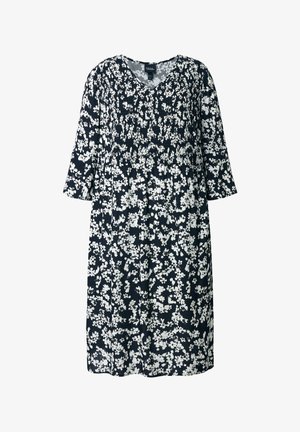 Blumenkleid mit marineblauem Hintergrund und weißem Blumenmuster, mit V-Ausschnitt, dreiviertel Ärmeln und tailliertem Design.