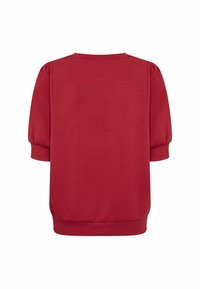 Top rosso a maniche corte con maniche a soffietto e bordi a costine, mostrato da dietro su uno sfondo bianco.