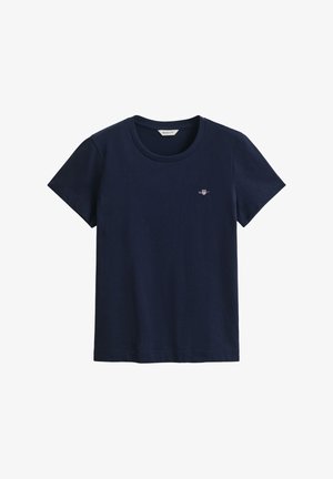 Marineblaue Baumwoll-T-Shirts mit kurzen Ärmeln, rundem Ausschnitt und einem kleinen, auf der Brust aufgestickten Logo. Weiche Textur, klassischer Schnitt.