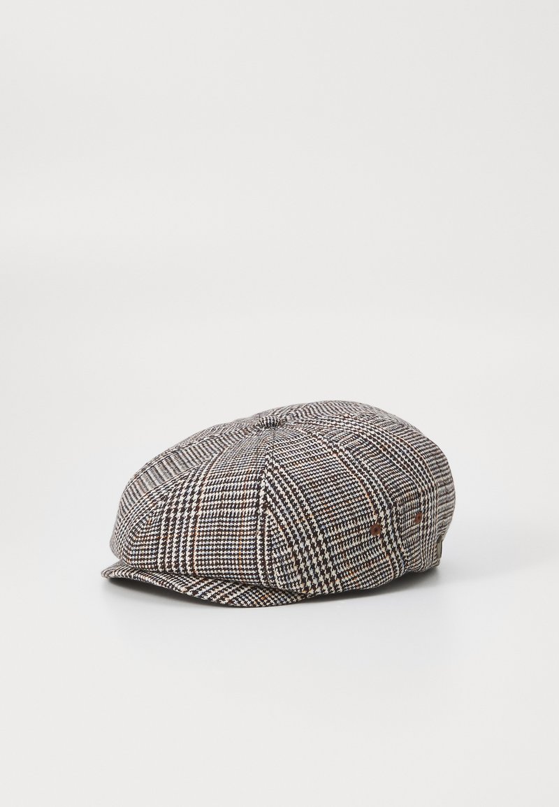 Newsboy cap in houndstooth pattern. Made from woven fabric, featuring a rounded top, small brim, and two side vents with brown accents.