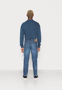 Lee RIDER - Calças de ganga justas - dark blue denim