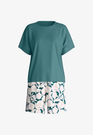 Teal short-sleeve crew neck top paired with dark green shorts featuring large white and light purple floral print.