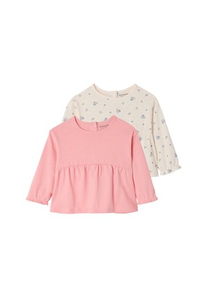 Two long-sleeve toddler tops, one solid pink with gathered waist, one cream with small blue floral and heart prints.