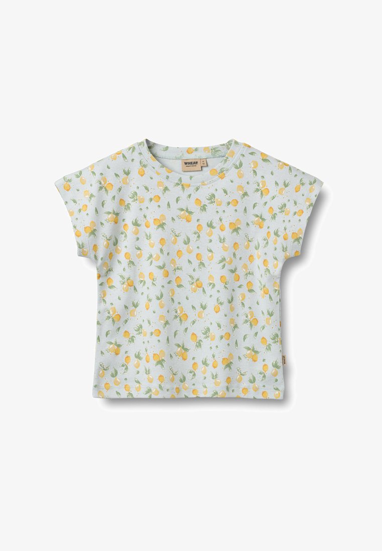 Witte korte mouw peutershirt met een patroon van gele citroenen en groene bladeren over het hele oppervlak.