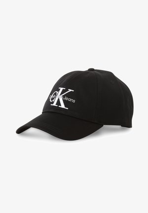 Boné de algodão preto com aba curva, apresentando o logótipo "CK" bordado em branco e o texto "Calvin Klein Jeans" na parte frontal.