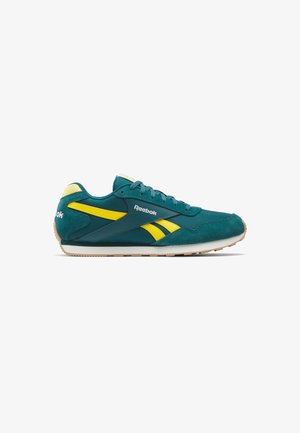 Zapatilla deportiva de ante verde azulado con acentos amarillos y suela de goma. Cuenta con el clásico logo de Reebok en el lateral, cierre con cordones y diseño de caña baja.
