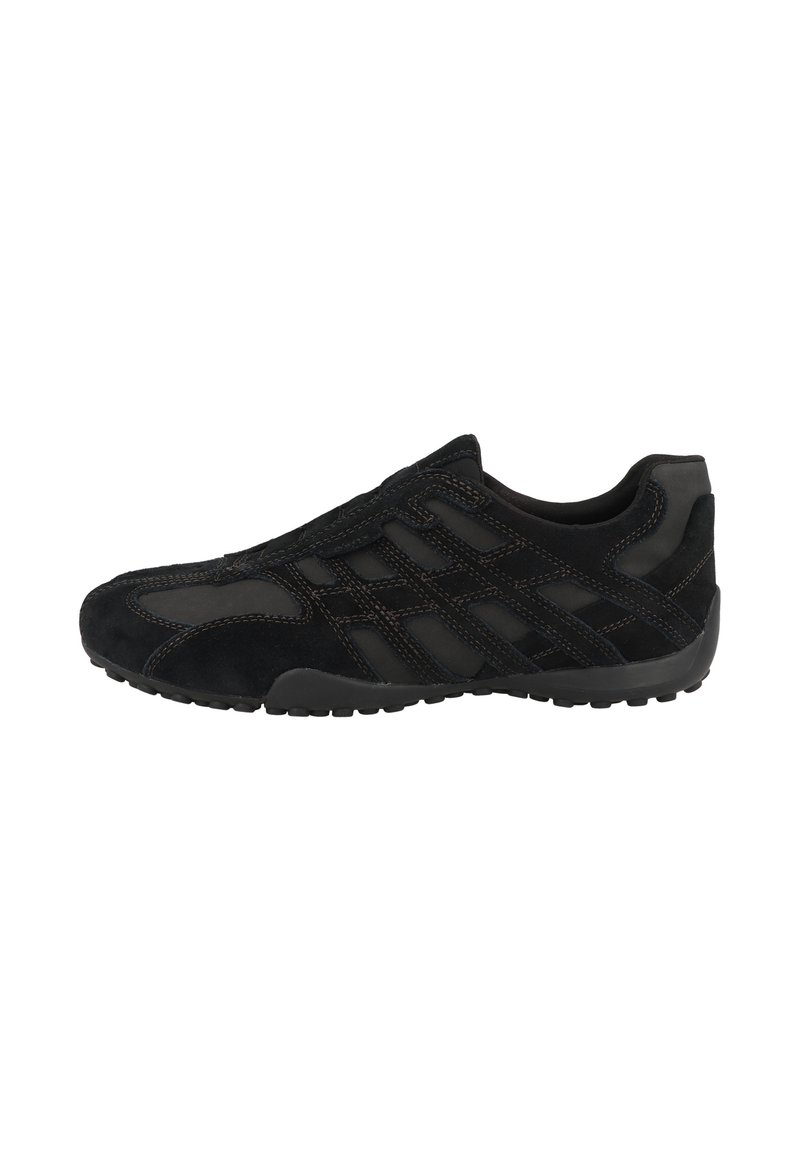 Black athletic shoes featuring a suede upper with mesh panels, curved shape, textured sole, and contrasting stitching details.