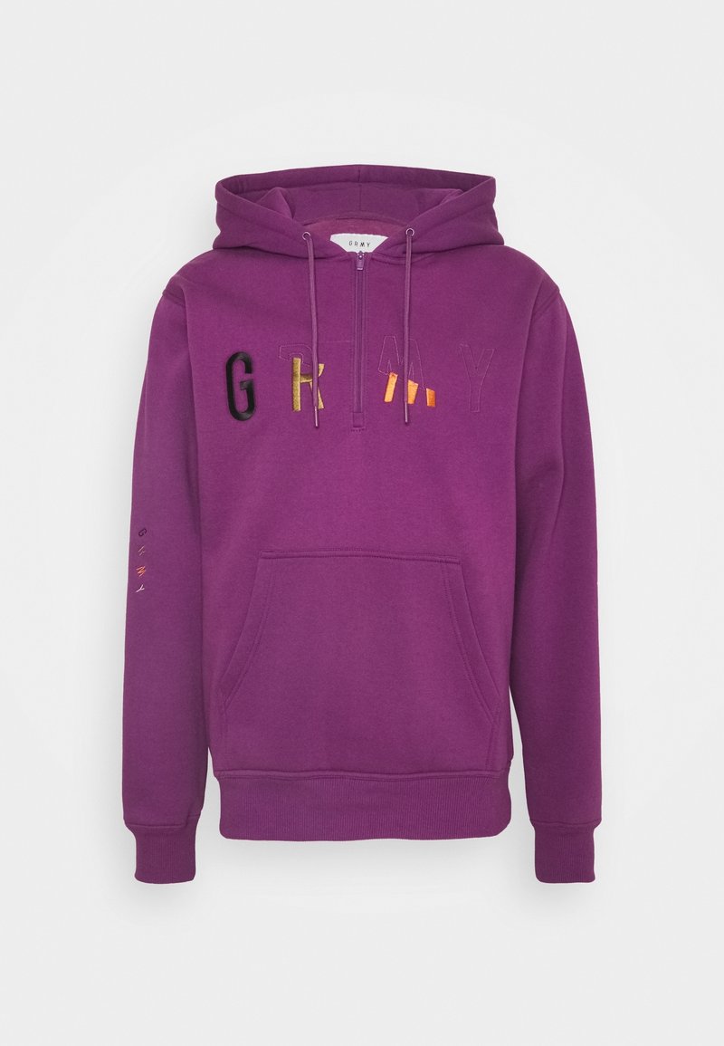 Sweat à capuche violet avec poche avant, fermeture éclair à moitié fermée, et broderie multicolore du texte "GRMY" sur la poitrine.
