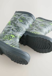Gray waterproof boots with a green and black camouflage pattern, rubber material, round top, and textured soles for traction.