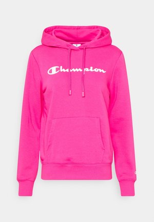 Sweat à capuche rose vif avec poche avant, capuche à cordon, poignets côtelés et logo blanc "Champion" sur la poitrine.