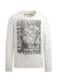 Langarmshirt mit Rundhalsausschnitt in hellem Beige mit einem grafischen Druck in Schwarz und Grau, der mechanische Elemente und Text zeigt. Weiche Textur.