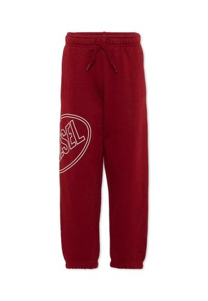 Pantalon de jogging rouge avec taille et poignets élastiques, poches avant, cordon de serrage et logo blanc Diesel imprimé sur la cuisse gauche.