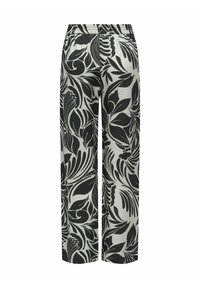 Zwart-witte broek met wijde pijpen, een elastische tailleband en een abstract bloemenpatroon dat de hele stof bedekt.