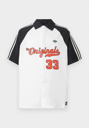 Hvit kortermet polo skjorte med svart krage, svarte ermer, rød "The Originals" grafikk, og "33" trykket i rødt på forsiden.