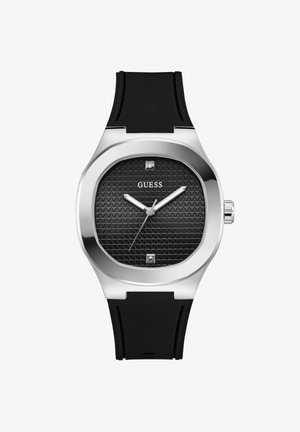 Hodinky GUESS s černým texturovaným ciferníkem, stříbrným pouzdrem, černým silikonovým páskem a stříbrnými ručičkami hodin, minut a sekund.