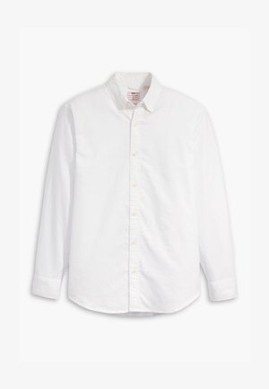 Camicia bianca a maniche lunghe in cotone. Presenta un colletto classico, chiusura con bottoni e una leggera texture con un logo discreto sul petto.