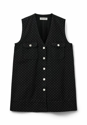 Černá bezrukávová vesta z bavlny, s bílými puntíky, dvěma předními kapsami a zapínáním na knoflíky s kulatými knoflíky.