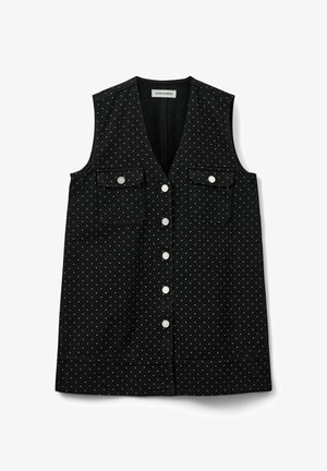 Musthave mustargiga must särk, mis on valmistatud puuvillast, valgete täppidega, kahe eelmisel tasku ja ümarate nuppudega nööbid.